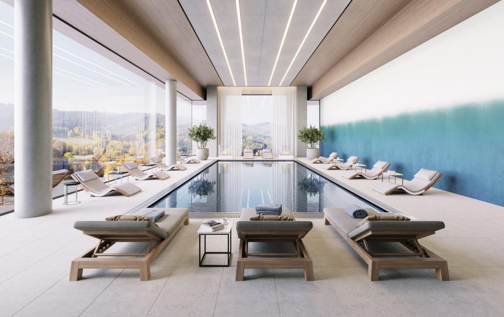 Interiorer Wellness-Poolbereich mit hellen Holzliegen, großen Glasfenstern, blauem Wandteil und Blick auf die umliegende Landschaft; Hue Winter Light von k'moor walldesign