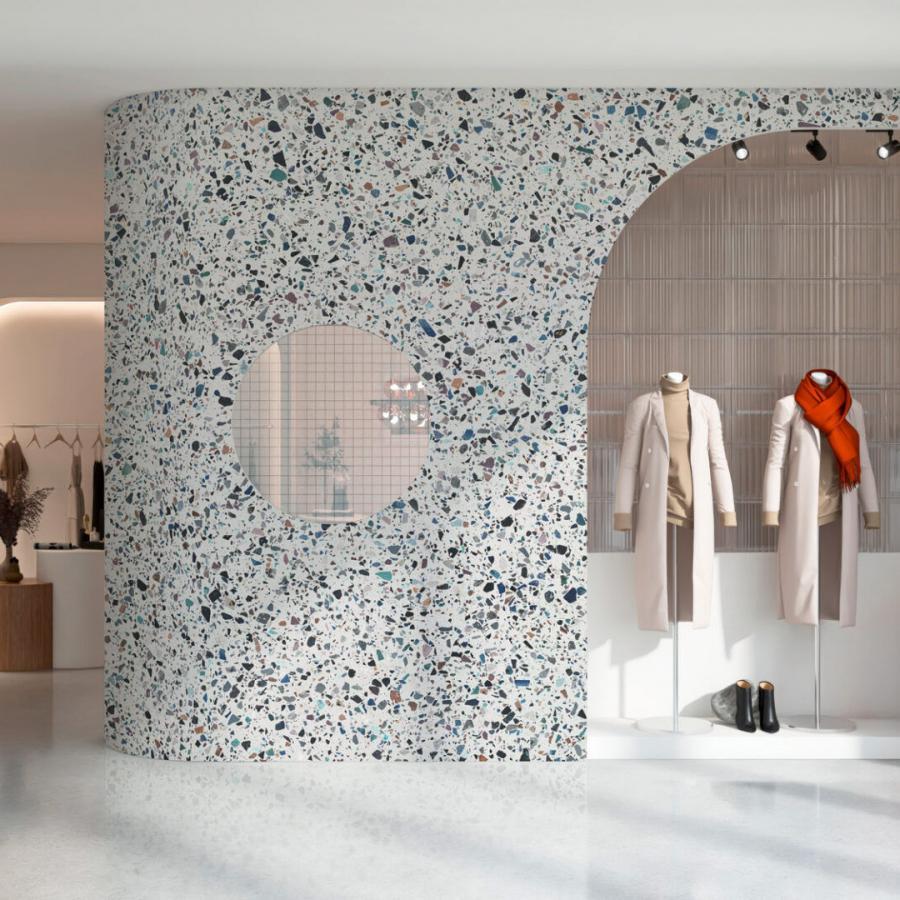 Helles Innenraum-Design mit terrazzo-Musterwand, Bezug auf Happy Terrazzo Light von k'moor walldesign, roter Schal am Mantel, kleiderständer, neutrale Farbtöne