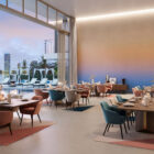 Candy ES-032 Wanddesign mit beige-blauem Verlauf an einer glatten Innenwand, elegante Couchtische, gedeckte Farben und stilvolle Sitzgruppe im Raum