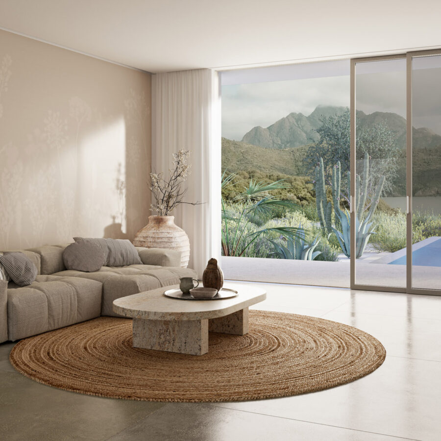 Beige Wandgestaltung „Soft Silhouettes Beige“ von k'moor walldesign mit sanftem Muster, warmem Wohnraum, Sofa und großem Fensterblick.